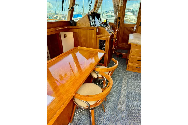 Slide: The Image of Interior of 1996 Grand Banks 46 Heritage CL yacht with wooden furnishings and helm station. - 18