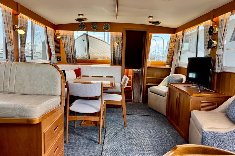 Slide: The Image of Luxurious interior of a 1996 Grand Banks 46 Heritage CL yacht, featuring elegant wood finishes. - 19