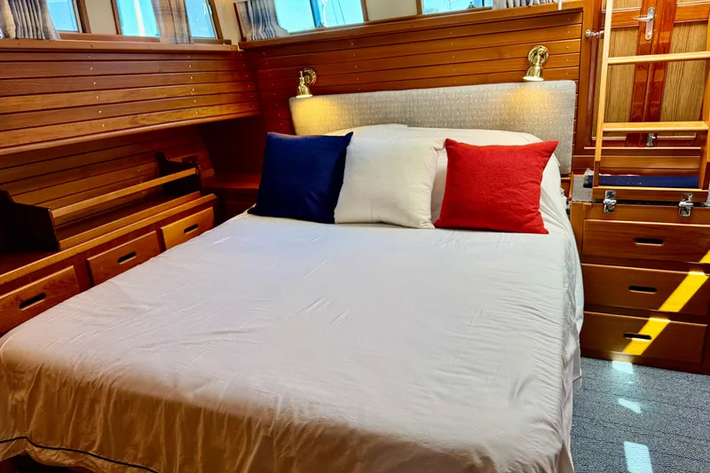 Slide: The Image of Cozy cabin bedroom in 1996 Grand Banks 46 Heritage CL yacht with colorful pillows. - 27