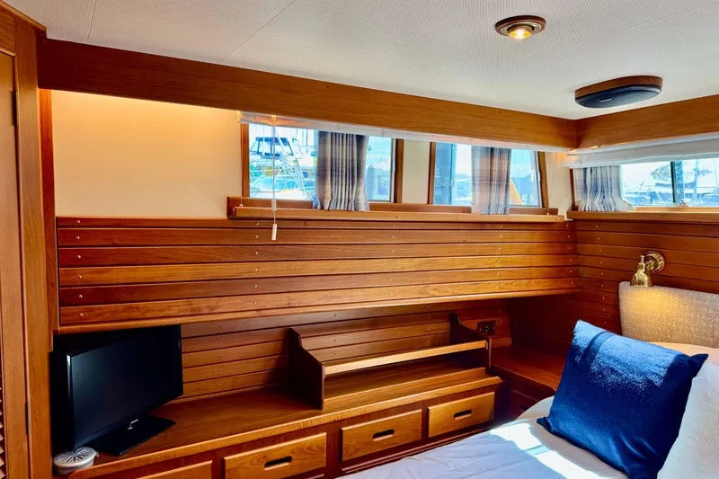 Slide: The Image of Luxurious wooden interior of 1996 Grand Banks 46 Heritage CL yacht cabin. - 30