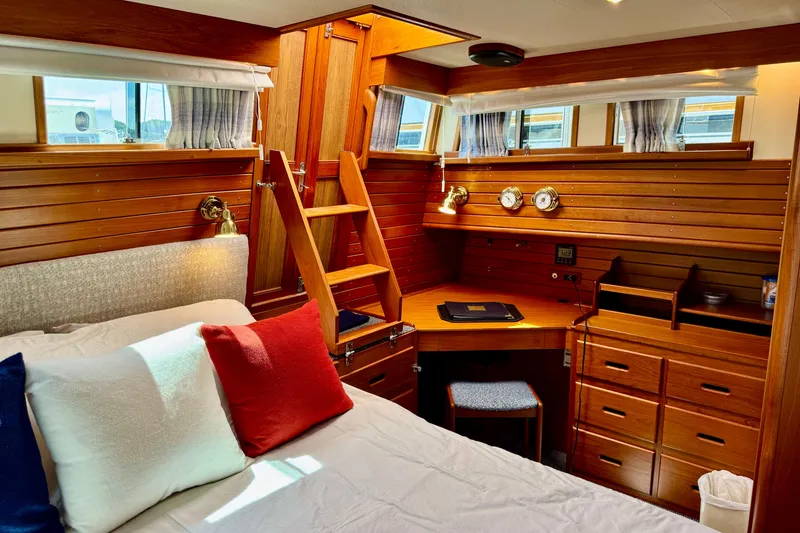 Slide: The Image of Luxurious 1996 Grand Banks 46 Heritage CL cabin with wooden interior and cozy bedding. - 31