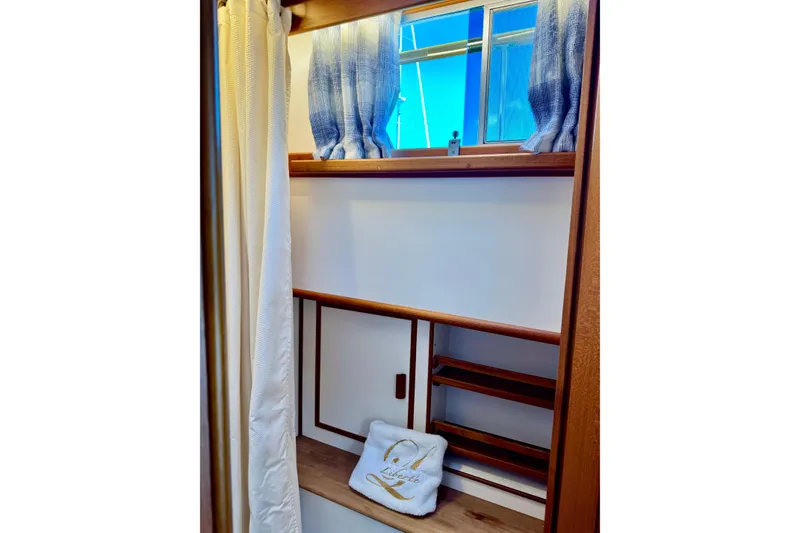 Slide: The Image of Interior of 1996 Grand Banks 46 Heritage CL with wooden shelves and window. - 34