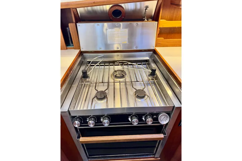 Slide: The Image of Stainless steel stove and oven in 1996 Grand Banks 46 Heritage CL yacht kitchen. - 42