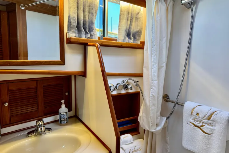 Slide: The Image of Bathroom interior of 1996 Grand Banks 46 Heritage CL yacht, featuring sink and shower. - 47