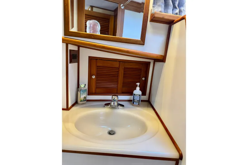 Slide: The Image of Bathroom sink area on a 1996 Grand Banks 46 Heritage CL yacht. - 48