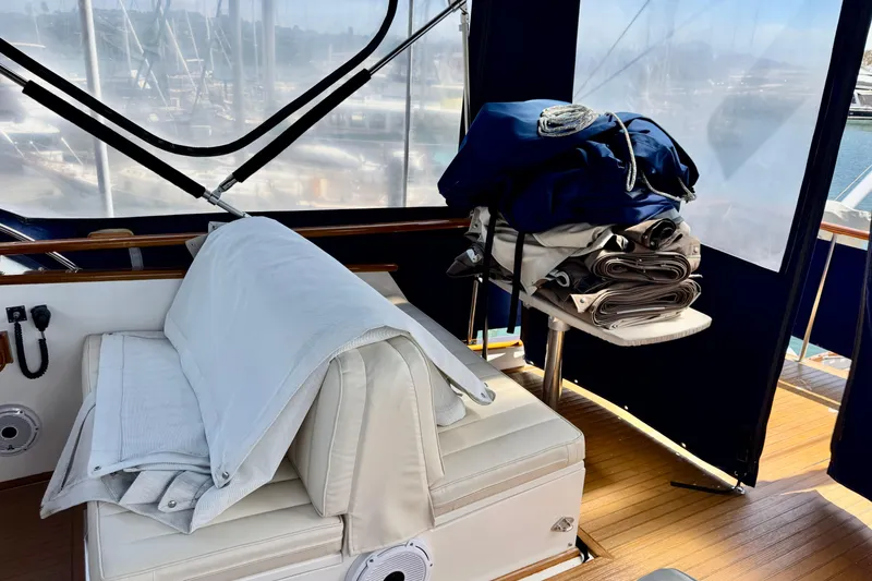 Slide: The Image of Interior of 1996 Grand Banks 46 Heritage CL yacht with seating and folded covers. - 57
