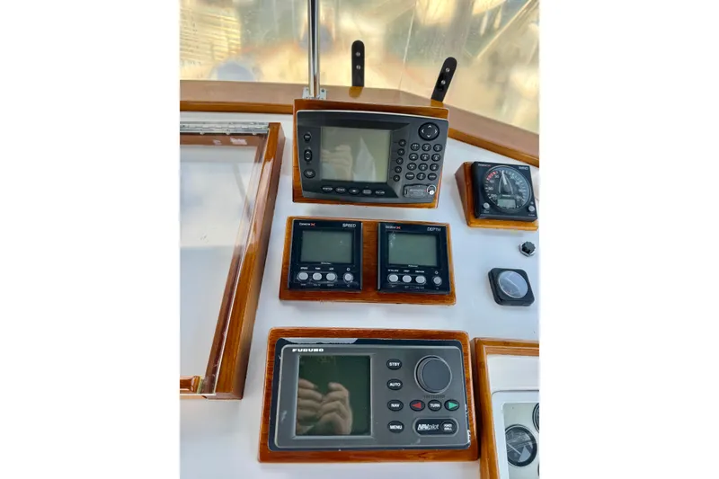 Slide: The Image of Navigation instruments on a 1996 Grand Banks 46 Heritage CL yacht dashboard. - 60