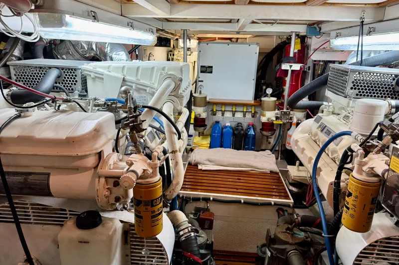 Slide: The Image of Engine room of a 1996 Grand Banks 46 Heritage CL yacht, showcasing machinery and equipment. - 61