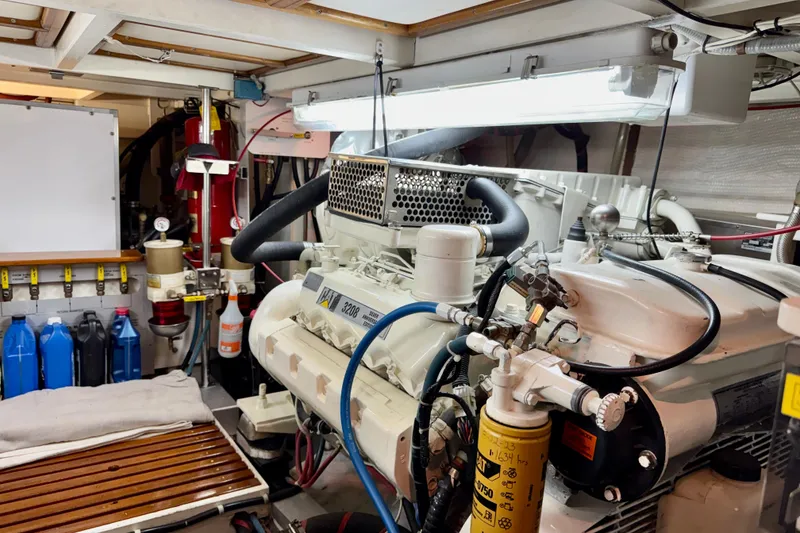 Slide: The Image of Engine room of a 1996 Grand Banks 46 Heritage CL yacht, featuring a CAT 3208 engine. - 62