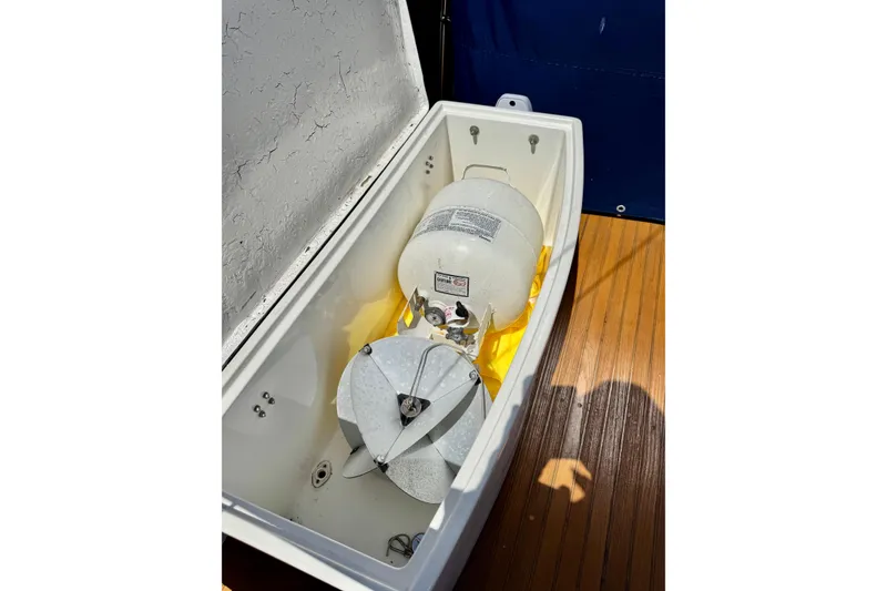 Slide: The Image of Open storage compartment on 1996 Grand Banks 46 Heritage CL with propane tank and equipment. - 75