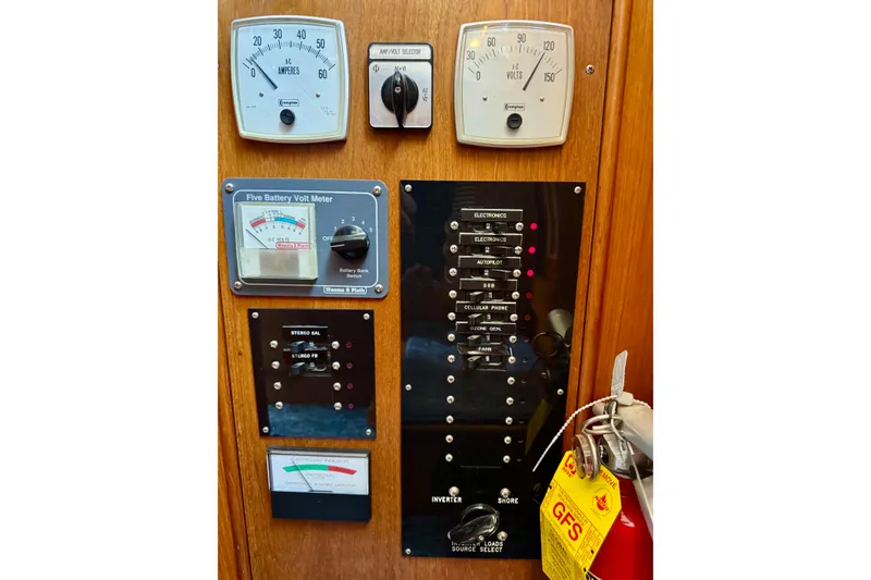 Slide: The Image of Electrical panel of a 1996 Grand Banks 46 Heritage CL yacht with gauges and switches. - 82