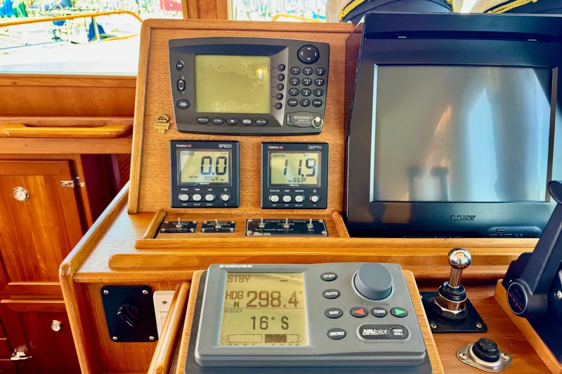 Slide: The Image of Control panel of a 1996 Grand Banks 46 Heritage CL yacht with navigation instruments. - 84