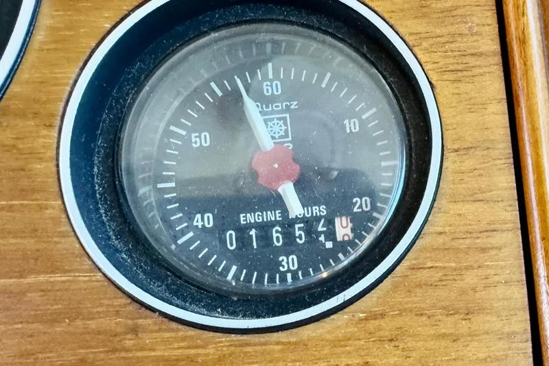 Slide: The Image of Close-up of a 1996 Grand Banks 46 Heritage CL engine hour meter displaying 1654 hours. - 86