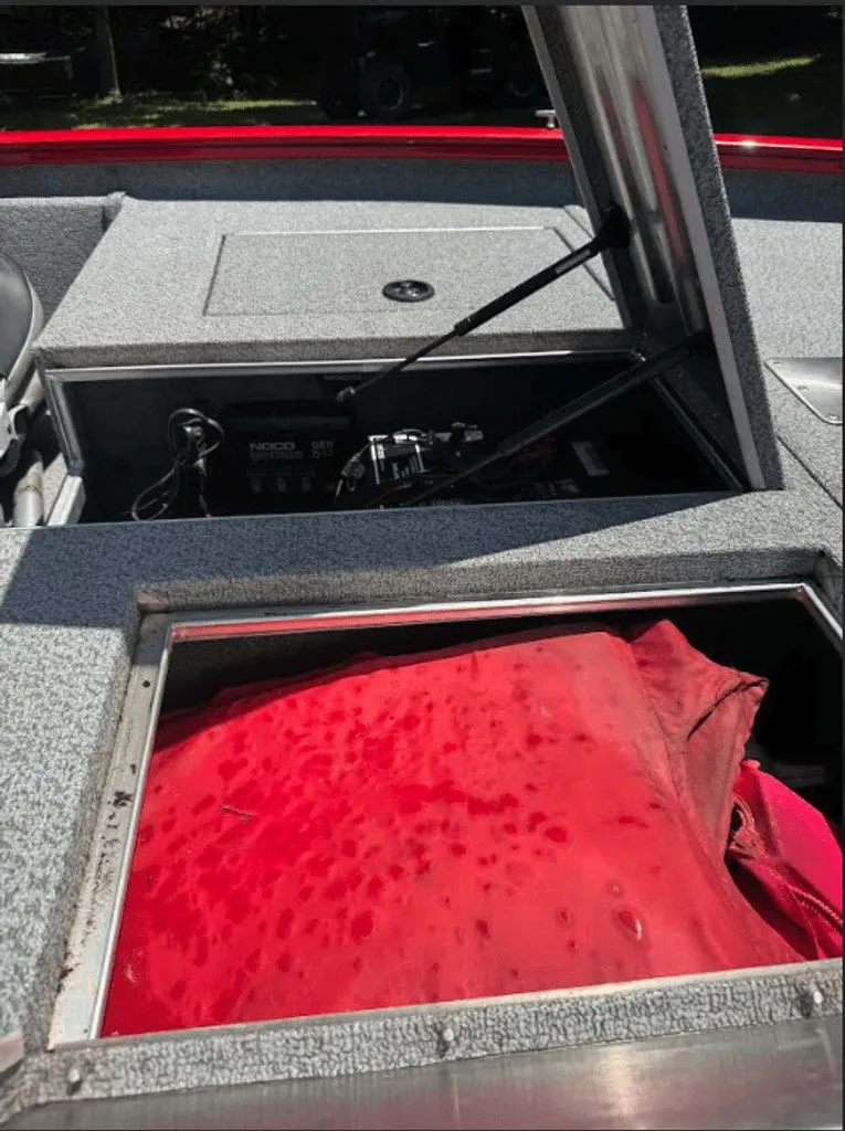 Slide: The Image of 2017 Tracker Pro Team 175 TXW boat with open storage compartment. - 13