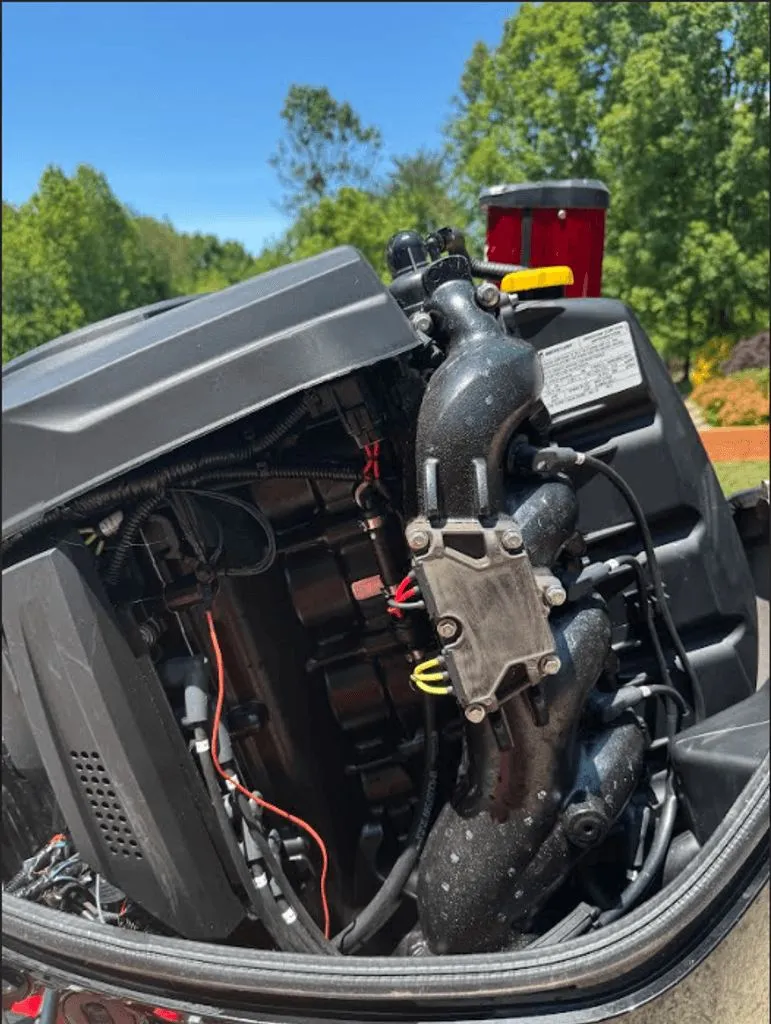 Slide: The Image of Engine of a 2017 Tracker Pro Team 175 TXW boat outdoors. - 25