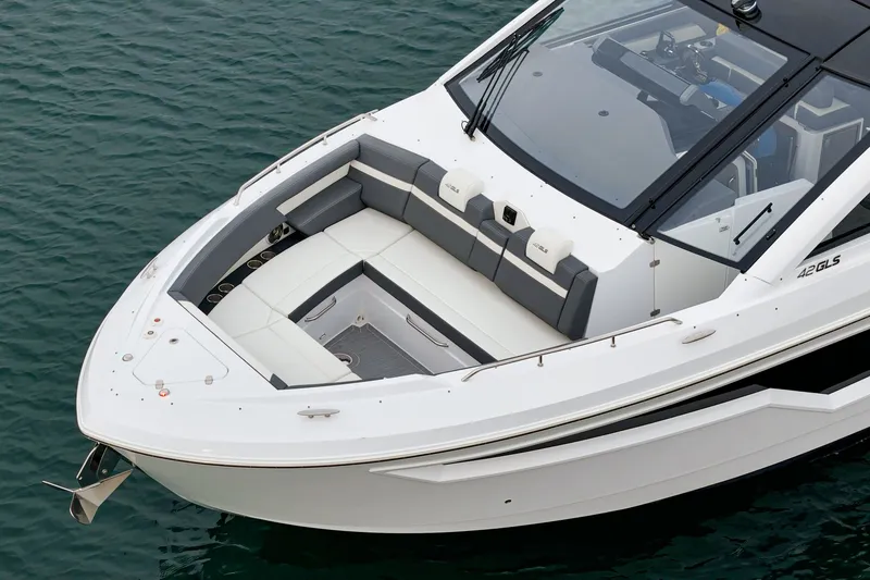 Slide: The Image of Cruisers 42 GLS 2022 boat with luxurious seating area on water. - 13