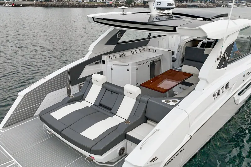Slide: The Image of Luxurious 2022 Cruisers 42 GLS yacht on calm waters. - 25