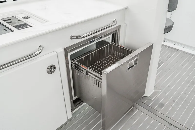 Slide: The Image of Open kitchen drawer on the 2022 Cruisers 42 GLS yacht. - 32