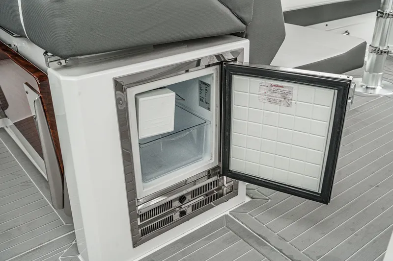 Slide: The Image of Open refrigerator on 2022 Cruisers 42 GLS yacht. - 38