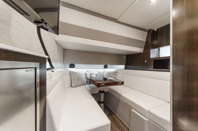 Slide: The Image of Interior of 2022 Cruisers 42 GLS yacht with white sofa and table. - 45