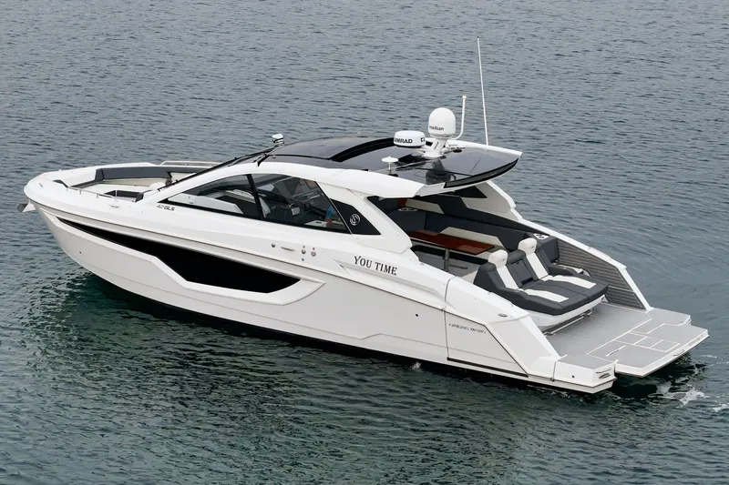 Slide: The Image of Luxurious 2022 Cruisers 42 GLS yacht on calm waters. - 8