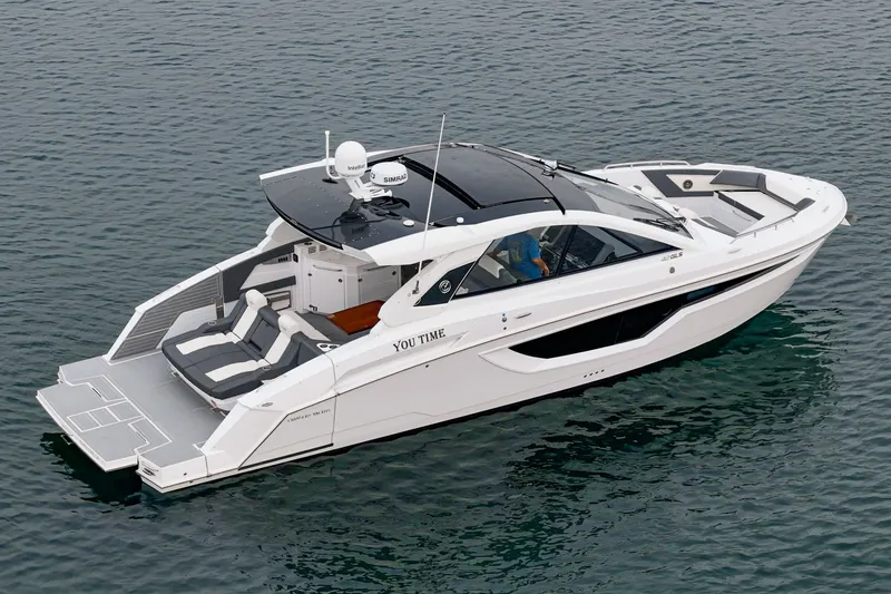 Slide: The Image of Luxurious 2022 Cruisers 42 GLS yacht on calm waters. - 9