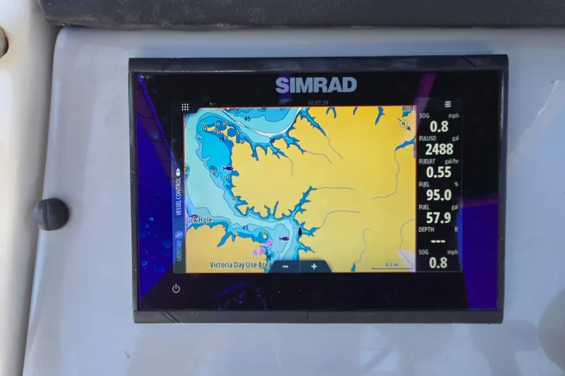 Slide: The Image of Simrad navigation display on 2023 Bayliner Trophy T22CC boat, showing detailed marine map. - 18