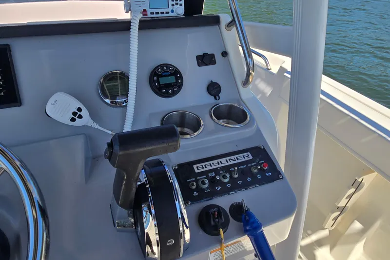 Slide: The Image of Control panel of 2023 Bayliner Trophy T22CC boat with steering and navigation equipment. - 19