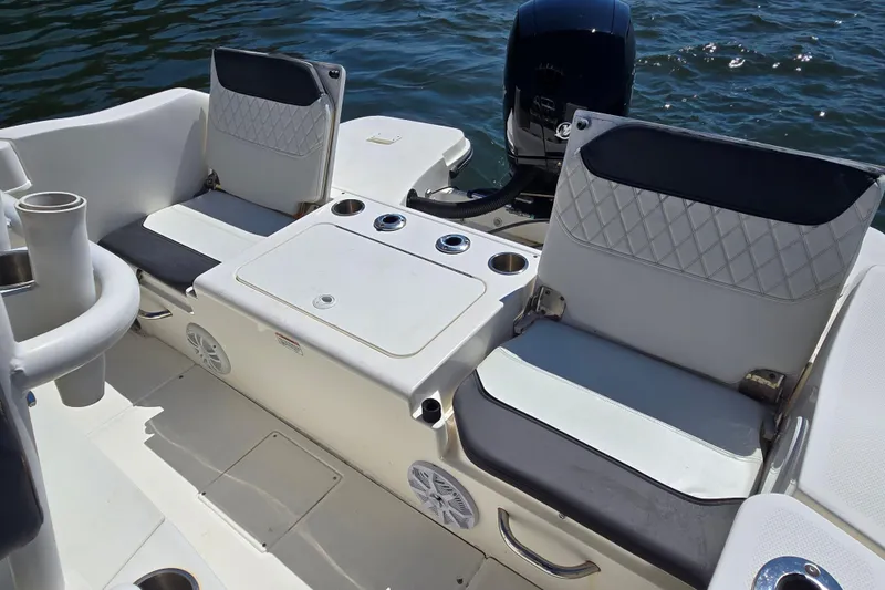 Slide: The Image of 2023 Bayliner Trophy T22CC boat interior with seating and storage compartments. - 20