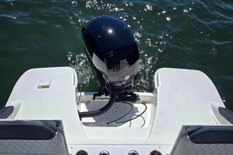 Slide: The Image of 2023 Bayliner Trophy T22CC boat with outboard motor on water. - 21