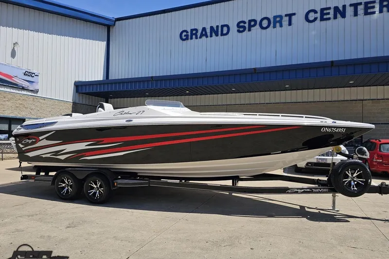 Slide: The Image of 2019 Baja 27 Outlaw boat on trailer at Grand Sport Center. - 11