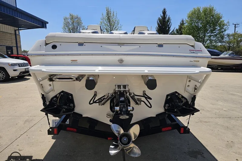 Slide: The Image of Rear view of a 2019 Baja 27 Outlaw boat with dual propellers. - 26