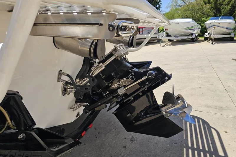 Slide: The Image of 2019 Baja 27 Outlaw boat stern drive and propeller in a marina setting. - 28