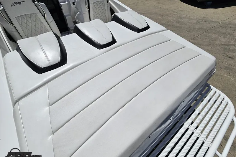 Slide: The Image of 2019 Baja 27 Outlaw boat interior with white cushioned seating and sleek design. - 31