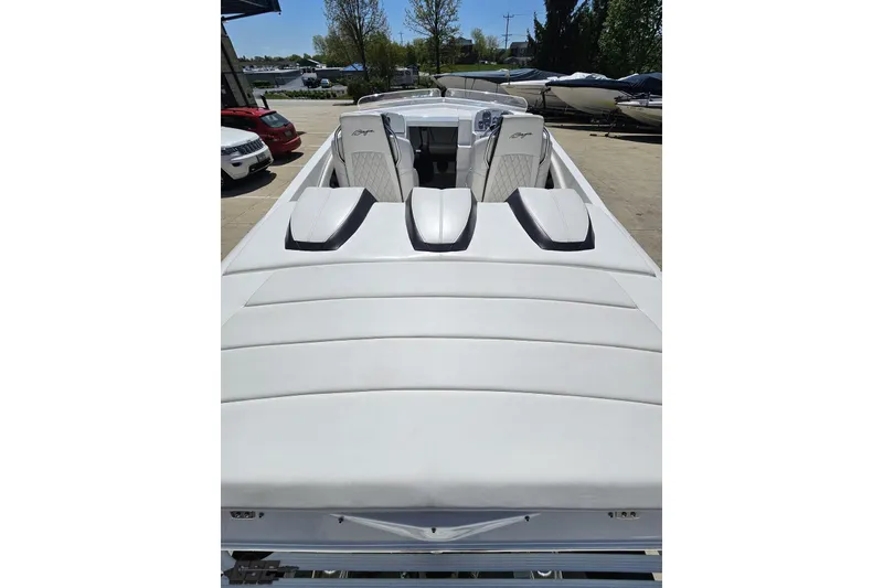 Slide: The Image of 2019 Baja 27 Outlaw boat with sleek white seating and modern design. - 32