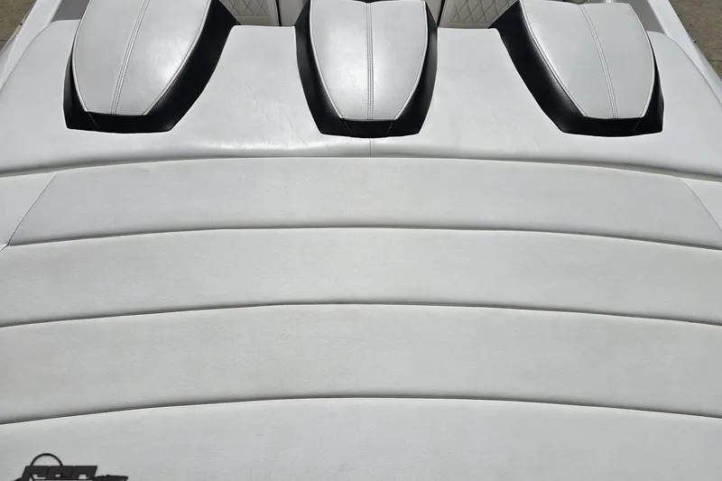 Slide: The Image of 2019 Baja 27 Outlaw boat with sleek white and black seating design. - 34