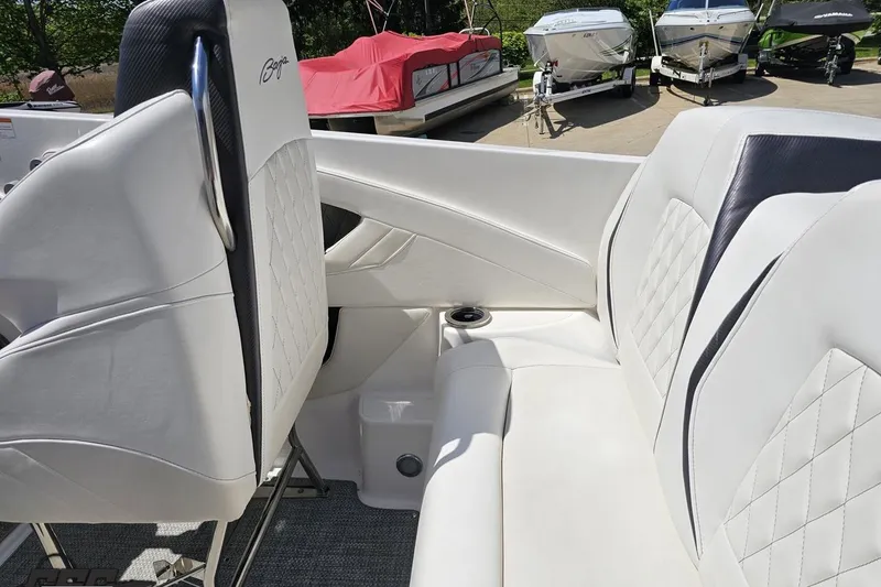 Slide: The Image of 2019 Baja 27 Outlaw boat interior with white leather seating and diamond stitching. - 37