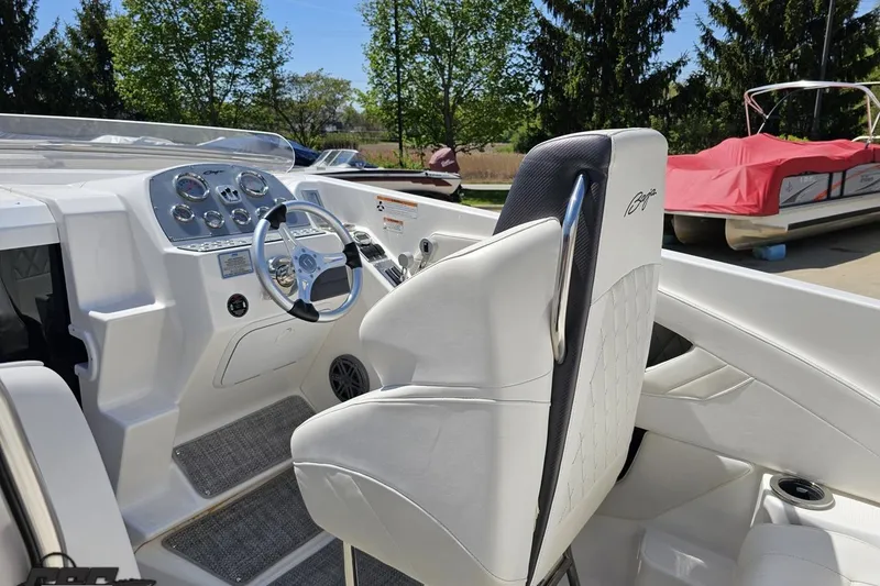 Slide: The Image of 2019 Baja 27 Outlaw boat cockpit with steering wheel and control panel. - 38