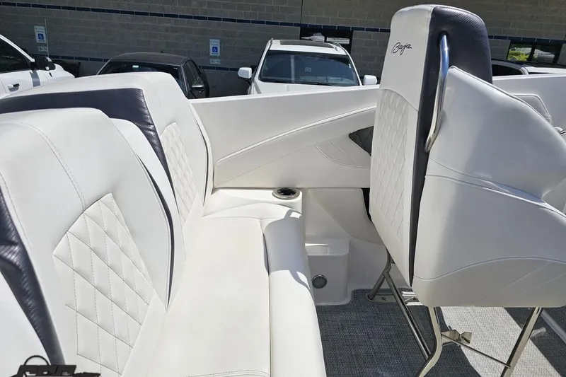 Slide: The Image of 2019 Baja 27 Outlaw boat interior with white leather seating and quilted design. - 39