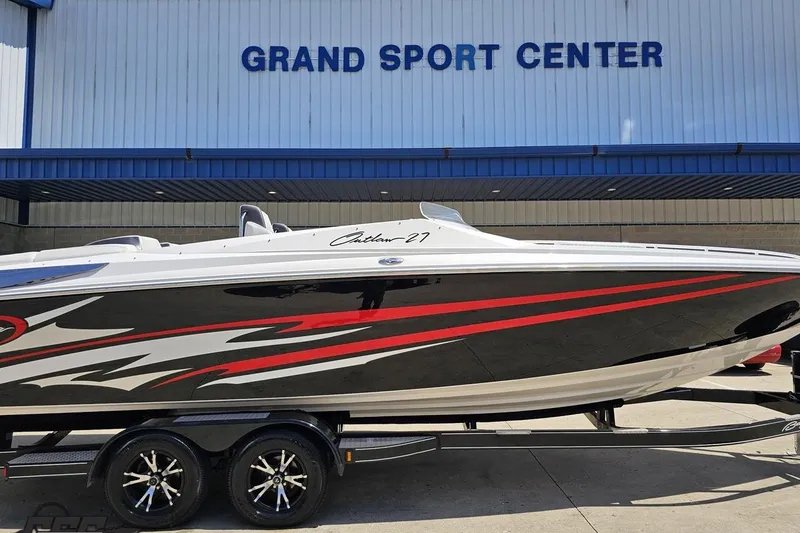 Slide: The Image of 2019 Baja 27 Outlaw boat with sleek design at Grand Sport Center. - 4