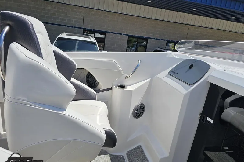 Slide: The Image of Interior of a 2019 Baja 27 Outlaw boat featuring sleek white seating and modern design. - 42