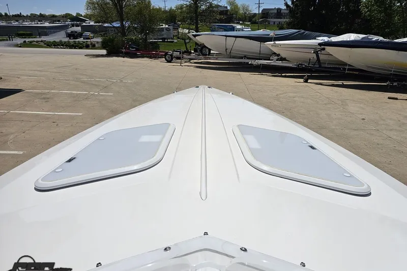 Slide: The Image of 2019 Baja 27 Outlaw boat deck view in a marina setting. - 47
