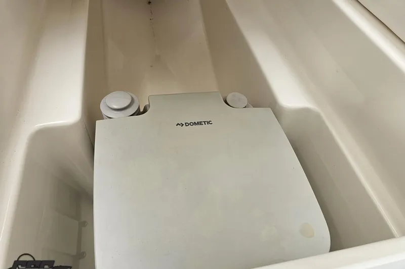 Slide: The Image of Dometic unit in 2019 Baja 27 Outlaw boat interior compartment. - 54
