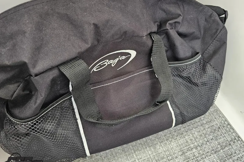 Slide: The Image of Black Baja duffel bag with mesh pockets, related to 2019 Baja 27 Outlaw model. - 55