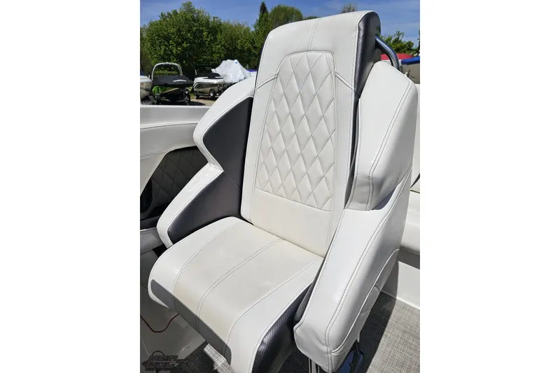 Slide: The Image of 2019 Baja 27 Outlaw boat seat with diamond-stitched white upholstery and black accents. - 59