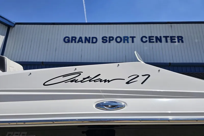 Slide: The Image of 2019 Baja 27 Outlaw boat at Grand Sport Center, showcasing sleek design. - 6