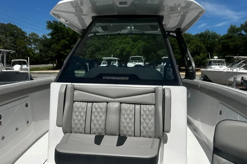 Slide: The Image of 2026 Monterey Elite 30 OB boat interior with luxurious seating and modern design. - 13