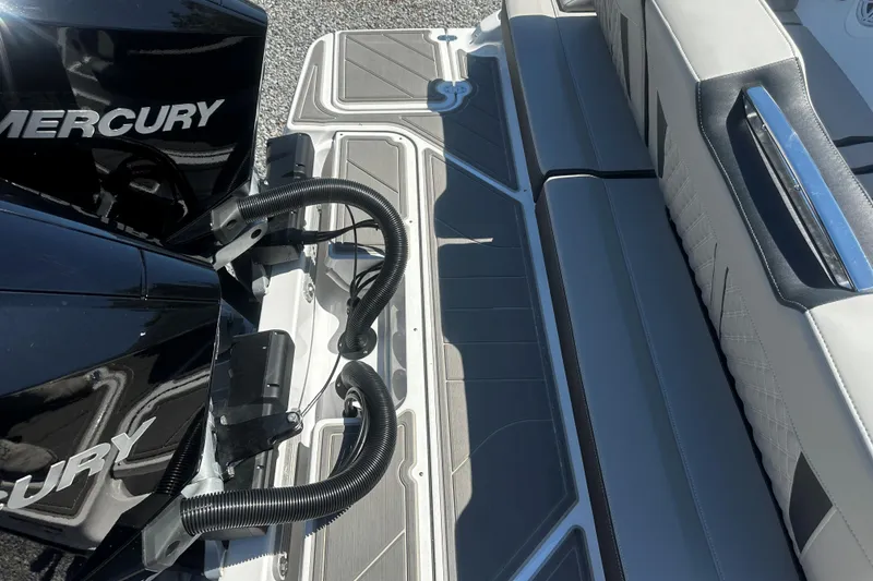 Slide: The Image of 2026 Monterey Elite 30 OB boat with Mercury engine and sleek seating area. - 4