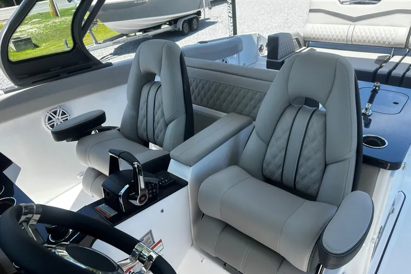 Slide: The Image of Luxury seating in the 2026 Monterey Elite 30 OB boat cockpit. - 7