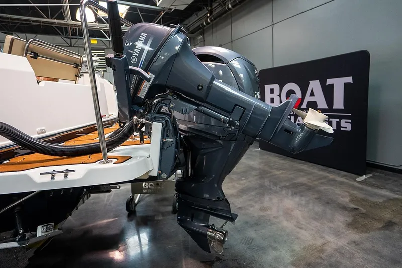 Slide: The Image of 2025 Ranger Tug R23 Luxury Edition with Yamaha outboard motor at boat show. - 12